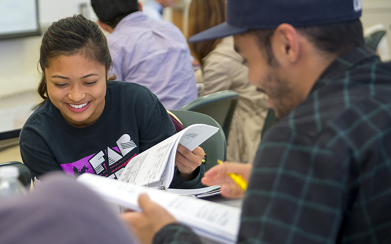 Students reading textbooks