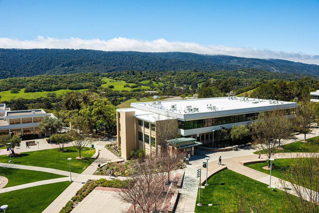 Cañada College campus in Redwood City, featuring open outdoor walkways surrounded by hillside landscaping