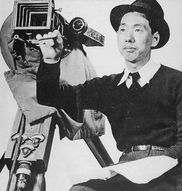 Japanese filmmaker Mikio Naruse with a camera
