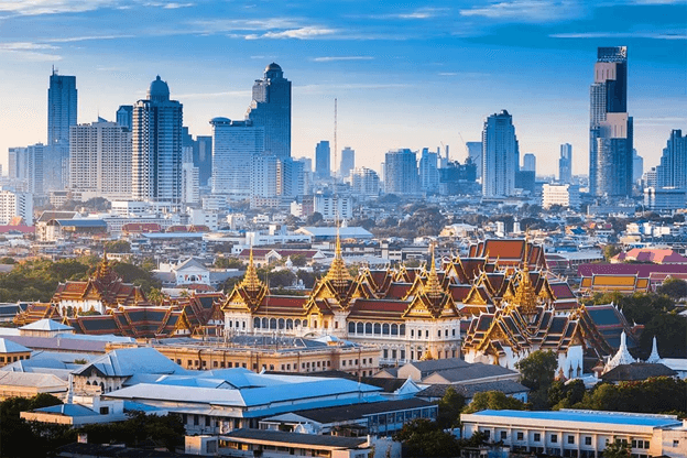 traditional Asian temples in front of a modern city skyline