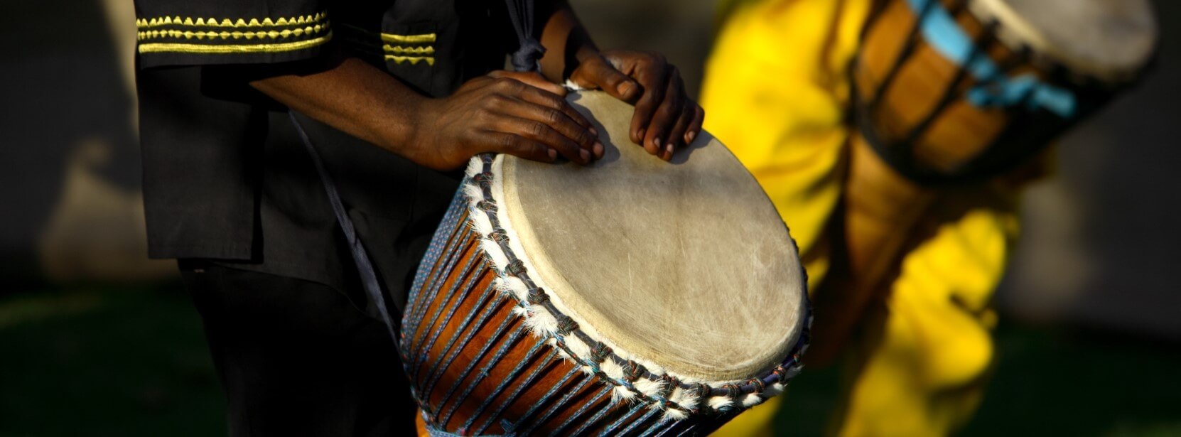 person plays a drum